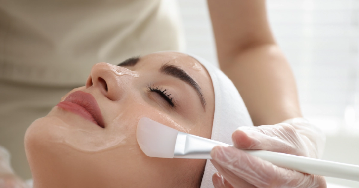 A professional applying a chemical peels to a woman's face in North Miami, FL